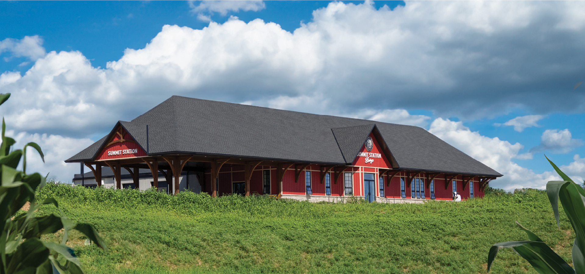 Exterior photo of the red Summit Station on-farm store sitting on top of the hill in Copetown